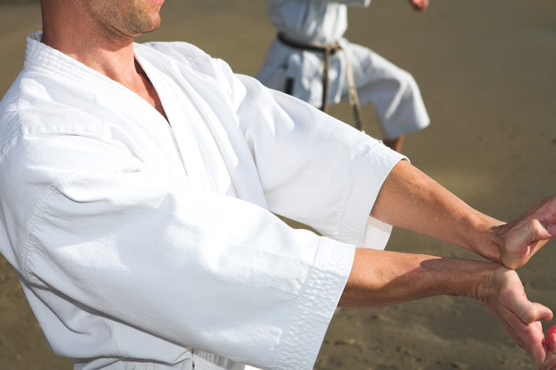 970709-men-practicing-karate-on-the-beach